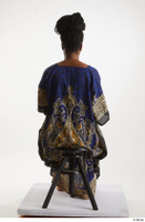  Dina Moses  1 dressed sitting traditional decora long african dress whole body 0003.jpg